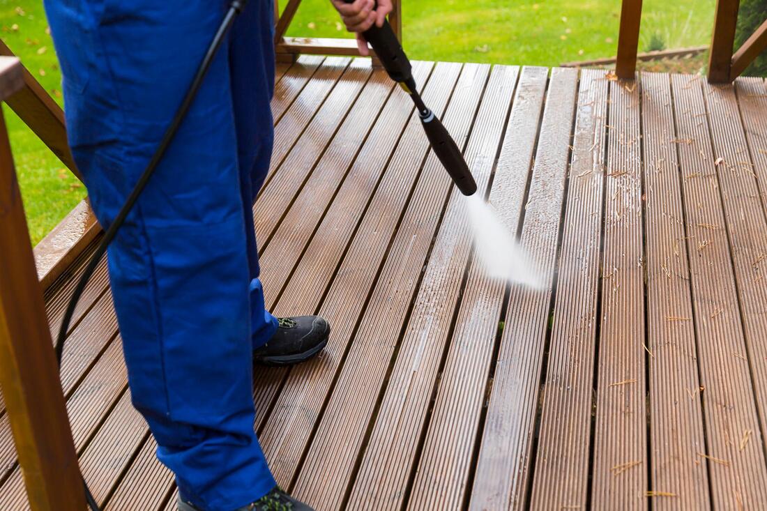 worker cleaning the deck