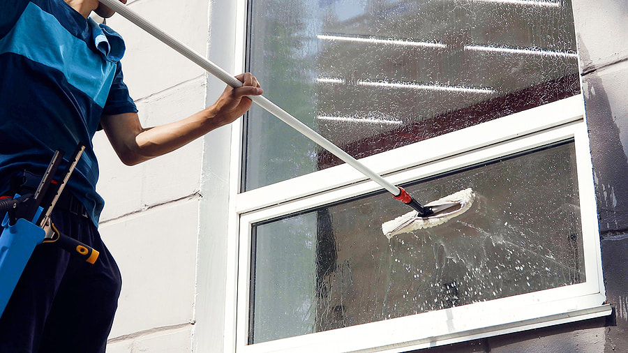 man cleaning the window